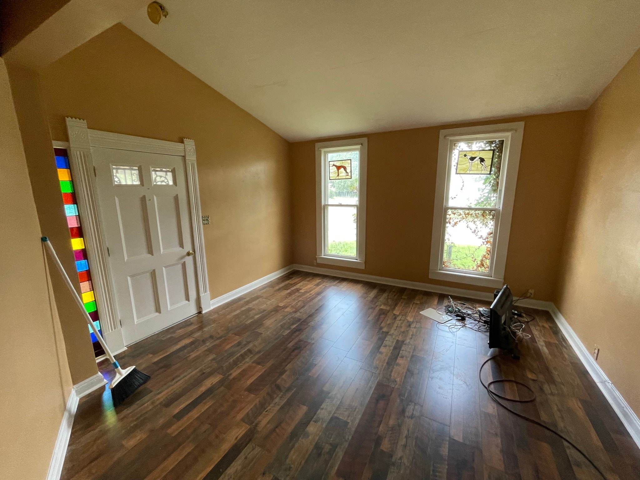 Living room after flooring — stunning dark hardwood luxury vinyl plank